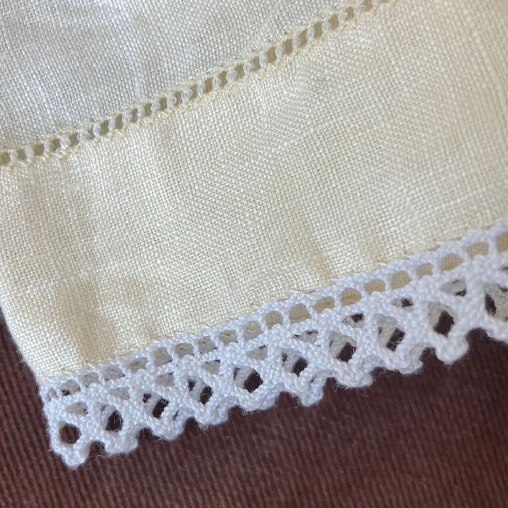 One fine linen embroidered tea towel. A muted butter yellow Vintage 1960s